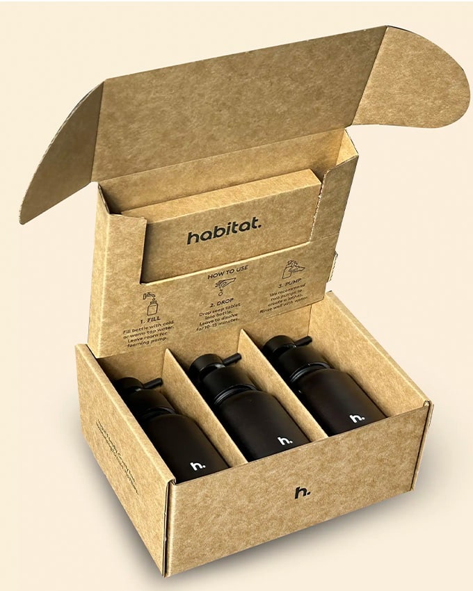 Eco-friendly mailer with a custom insert holding a refillable beauty bottle for safe eCommerce delivery
